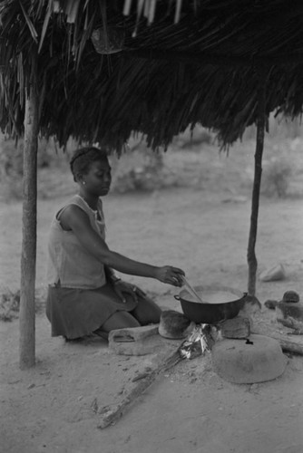 A young woman stirring a pot, San Basilio de Palenque, 1977