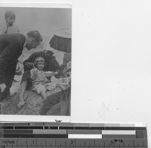 Maryknoll Father with refugees at Hong Kong, China, 1939