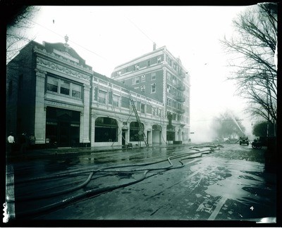Stockton - Fires and Fire Prevention 1920-1930, 1940-1950: Fire crews hosing top of Eden Square Building, N. El Dorado St. and Acacia St., Frank S. Boggs office