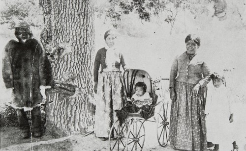 Inéseño Chumash Indians at Zanja de Cota. Left to right: Rafael Solares, María Antonia Aguirre (?), Jasper Miranda (?), María Solares and unidentified child : about 1889