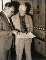 Lee de Forest and man checking schematic