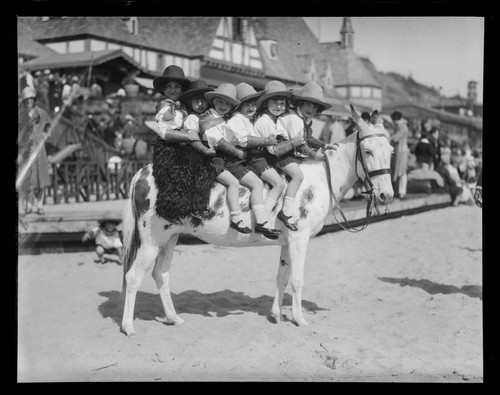 Meglin Kiddies riding a mule in front of Gables Beach Club, Santa Monica