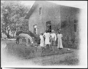 Children in front of the mission house, Arusha, Tanzania, ca. 1924-1930
