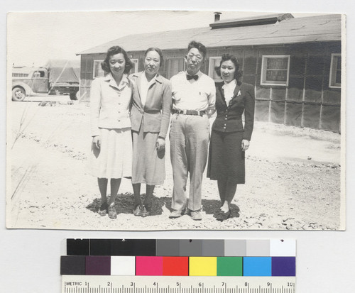 To Yoshi--taken June 15--1943. [My sister (far right) and I, with our parents, on the day of our departure for the outside world. Topaz, 1943.] [CNEGS available.]