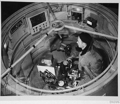 Bill Baum with stellar photometer inside the 200-inch telescope prime focus cage, Palomar Observatory