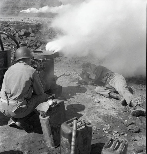Soldier operating smoke generator