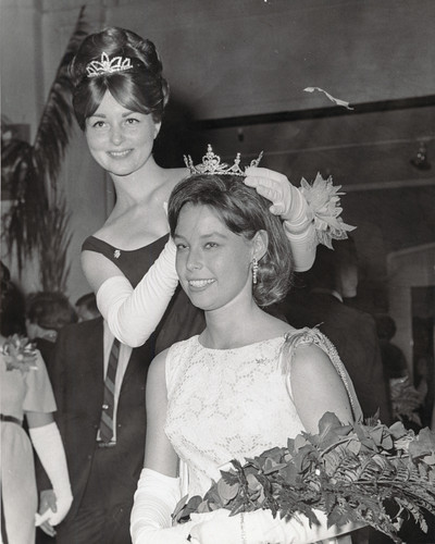 Photograph of Home Coming Queen Carolyn Masters being crowned by another female student