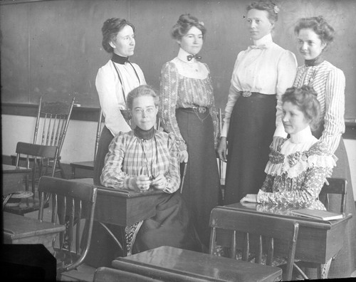 [Portrait of women in a classroom]