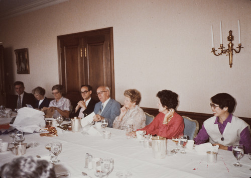 Photograph of Floyd R. Erickson at his retirement party with staff