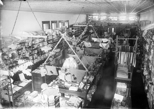 Upland Photograph Business; Interior view of the E.H. Haury & Co. Dry Goods and Variety Store decorated for Christmas / Edna Swan