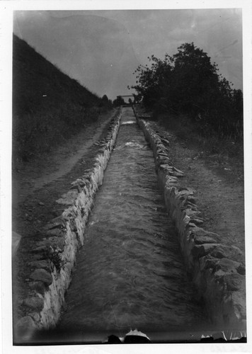 Upland Photograph Landscape; irrigation ditch with water running uphill / Edna Swan