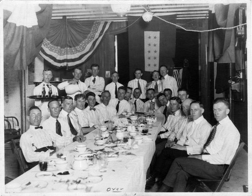 Upland Photograph Events; Upland Fire Department Party: 24 men seated or standing around a banquet table