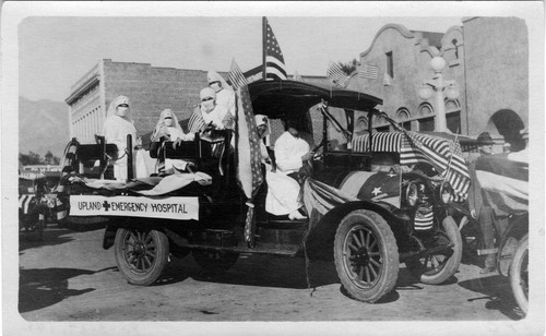 Upland Photograph Events; Victory Day Parade 1918: nurses in bed of truck with sign Upland Emergency Hospital / Melicent Arner