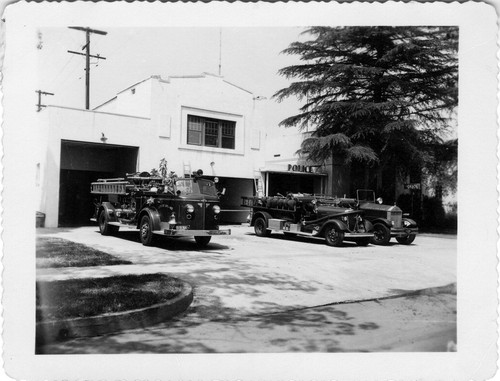 Upland Photograph Public Services; Upland Fire Department three fire trucks parked at station / L. T. Gotchy