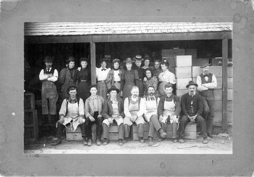 Upland Photograph Agriculture--Citrus; Citrus workers seated and standing on porch of packing shed / Esther Boulton Black Estate