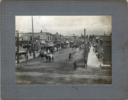 Upland Photograph Events; Fourth of July Parade: riders on horseback traveling south on unpaved 2nd Avenue, Upland, CA