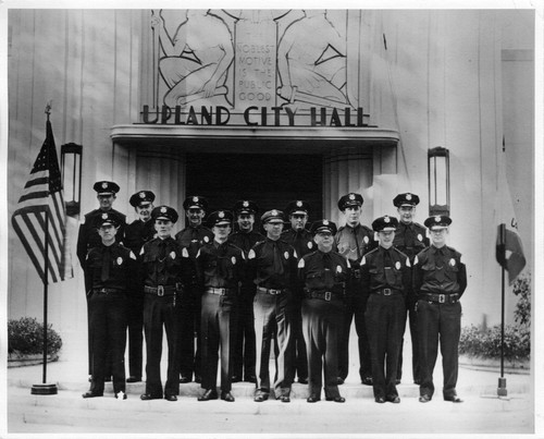 Upland Photograph Public Services; Upland Police Department: police officers standing at ease at the entrance to Upland City Hall