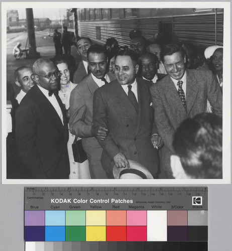 Ralph J. Bunche with Henry Moon, Roy Wilkins, and Will Rogers, Jr. at the 1949 NAACP Convention in Los Angeles, Calif