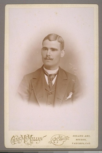 [Portrait of unidentified man. Photograph by Charles McMillan.]