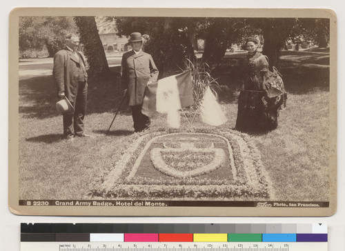 Grand Army Badge, Hotel del Monte. [William Boggs, Mariano Guadalupe Vallejo and unidentified woman, next to floral badge on lawn.]