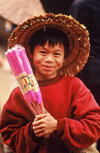 Boy selling incense, Ha Nam Province