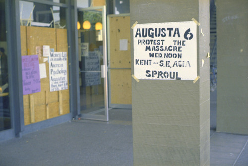 Week of May 5, 1970. Poster for Augusta 6 on wall of UC building