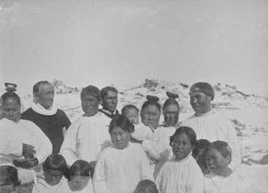 Pastor Rosing and missionary Julius Olsen with newly baptized East Greenlanders. Angmagssalik