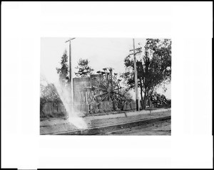 Old water wheel on the Zanja Madre on South Alameda Street near Washington Boulevard, ca.1900