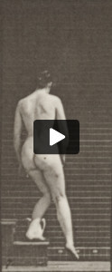 Nude woman descending stairs and stooping