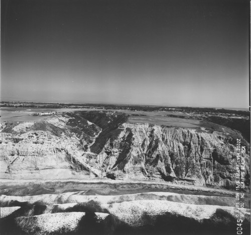 Aerial view of Sumner Canyon beach and cliffs north of Scripps Institution of Oceanography. 16 Sept 1954