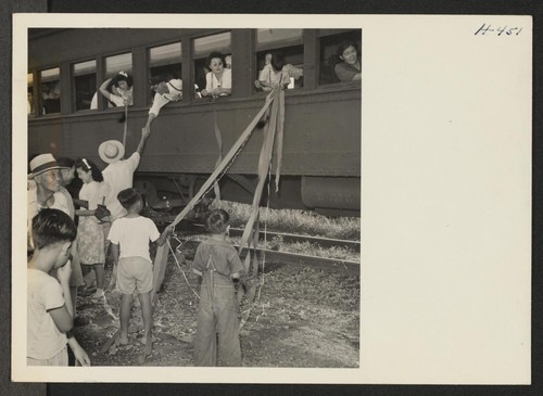 Closing of the Jerome Center, Denson, Arkansas. A sentimental custom still practiced by many when friends part is the trailing