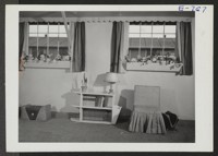 This model apartment was furnished by the High School Economics Class for the Arts and Crafts Festival held at the Granada Center, March 6th to 8th. The festival was sponsored by the Pioneer and Education Division. Photographer: Coffey, Pat Amache, Colorado