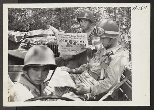 The Japanese-Americans who compose the 442nd combat team in training at Camp Shelby are keenly interested in daily news from