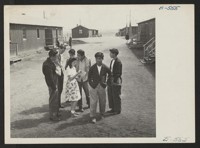Heart Mountain high school campus scene. Classes are housed in tar paper-covered barracks-style buildings originally designed as living quarters for the evacuees. Photographer: Hosokawa, Bill Heart Mountain, Wyoming