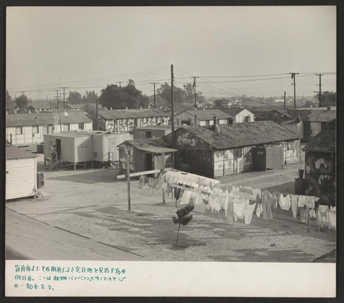 A section of the barracks and service building area of the Winona Housing Project at Burbank, California, where returning evacuees find temporary housing while they are locating permanent homes in and around Los Angeles. Photographer: Parker, Tom Burbank, California