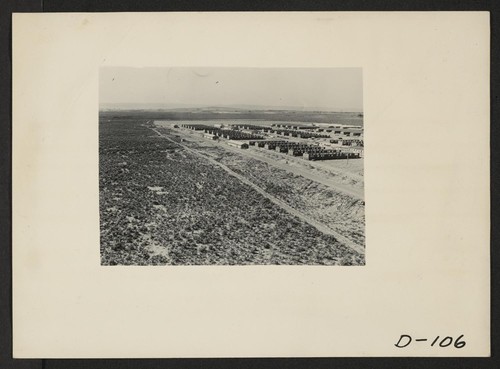 Eden, Idaho--A panorama view of the Minidoka War Relocation Authority center. This view, taken from the top of the water tower at the east end of the center, shows partially completed barracks. Photographer: Stewart, Francis Hunt, Idaho