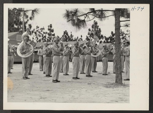 442nd combat team band plays the National Anthem at retreat. The 442nd combat team at Camp Shelby is composed entirely