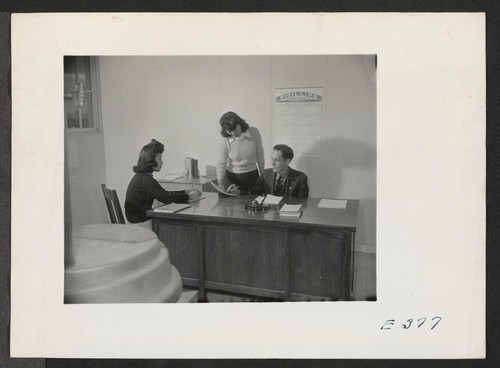 Mr. H. Zeigler, Elementary Principal, and his office staff, Miriam Minamo, Secretary (right), and Barbara Hamabe, File Clerk. Photographer: Parker, Tom McGehee, Arkansas