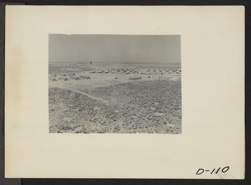 Eden, Idaho--A panorama view of the Minidoka War Relocation Authority center. This view, taken from the top of the water tower at the east end of the center, shows partially completed barracks. Photographer: Stewart, Francis Hunt, Idaho