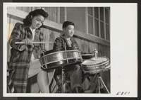 A snare drum section of the high school band, in a practice session. Most of the student band members are