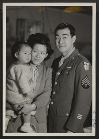 T/4 Taniguchi visits his wife and daughter at the Minidoka Relocation Center before returning to his unit in the Pacific