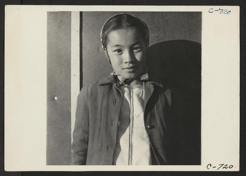 Manzanar, Calif.--A young evacuee of Japanese ancestry at this War Relocation Authority center. Photographer: Lange, Dorothea Manzanar, California