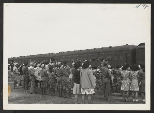 OUTGOING--Waving good-bye to departees on train. Photographer: Aoyama, Bud Heart Mountain, Wyoming