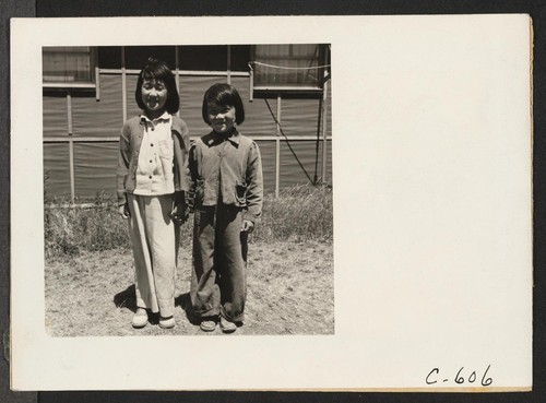 Tanforan Assembly Center, San Bruno, Calif.--Young evacuees at this Assembly Center begged to have their pictures taken. Photographer: Lange, Dorothea San Bruno, California