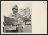 Pfc. Thomas Higa, 27-year-old Japanese American war veteran and smallest member of the 100th Battalion, who is in Denver to