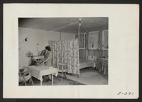 A typical interior of a barracks home. Photographer: Parker, Tom Denson, Arkansas