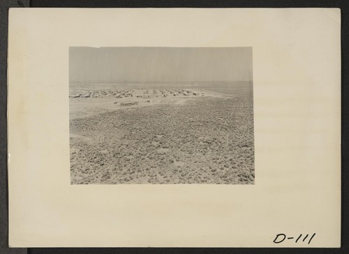 Eden, Idaho--A panorama view of the Minidoka War Relocation Authority center. This view, taken from the top of the water tower at the east end of the center, shows partially completed barracks. Photographer: Stewart, Francis Hunt, Idaho