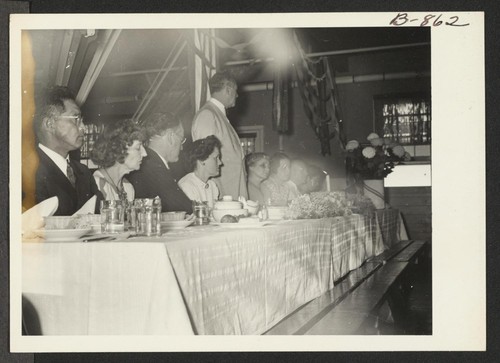 Speakers' table at the hospital staff banquet held in the Amache hospital. Photographer: McClelland, Joe Amache, Colorado