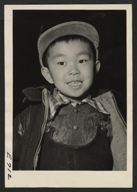A Sansei, or third generation boy of Japanese ancestry. His father, a Nisei, second generation, American citizen, and the rest of his family, evacuated from the west coast areas, now reside at the Heart Mountain Relocation Center. Photographer: Parker, Tom Heart Mountain, Wyoming