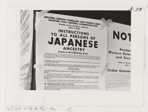 Exclusion Order posted at First and Front Streets directing removal of persons of Japanese ancestry from the first San Francisco section to be affected by evacuation. Evacuees will be housed in War Relocation Authority centers for the duration. Photographer: Lange, Dorothea San Francisco, California